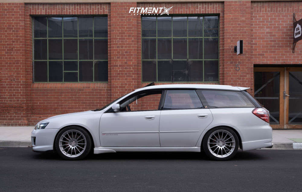 Side shot of a modified White 2005 Subaru Legacy GT Limited with Enkei RS05-RR wheels, Michelin Pilot Sport 4 tiers, and BC Racing coilovers