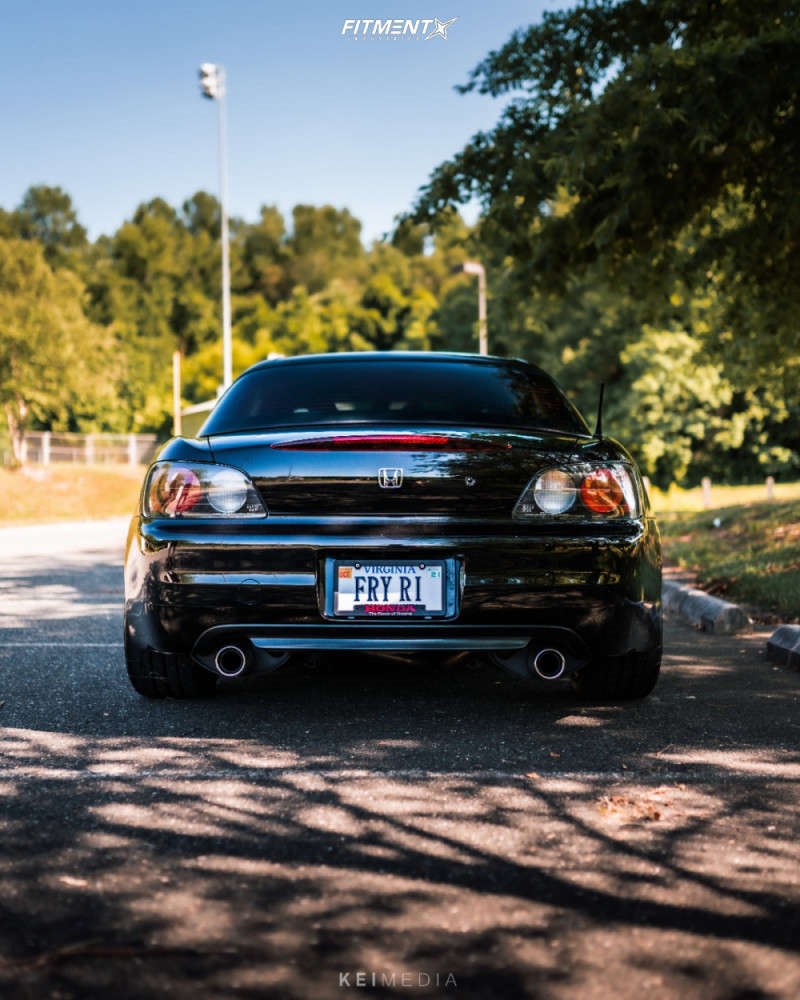 The rear of a Honda S2000 running Volk wheels and lowering springs