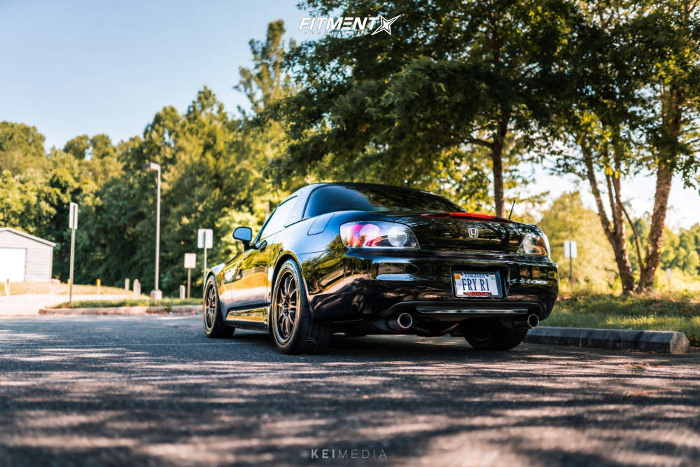 A super clean example of a Honda S2000 with tasteful mods like wheels, tires, and suspension